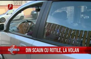 Din scaun cu rotile, la volan