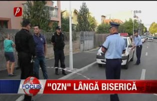 Ozn lângă biserică