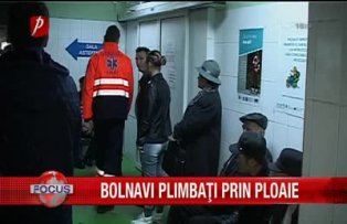 Bolnavi plimbati prin ploaie