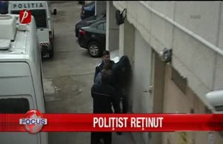 Politist retinut
