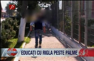 Educatie cu rigla peste palme